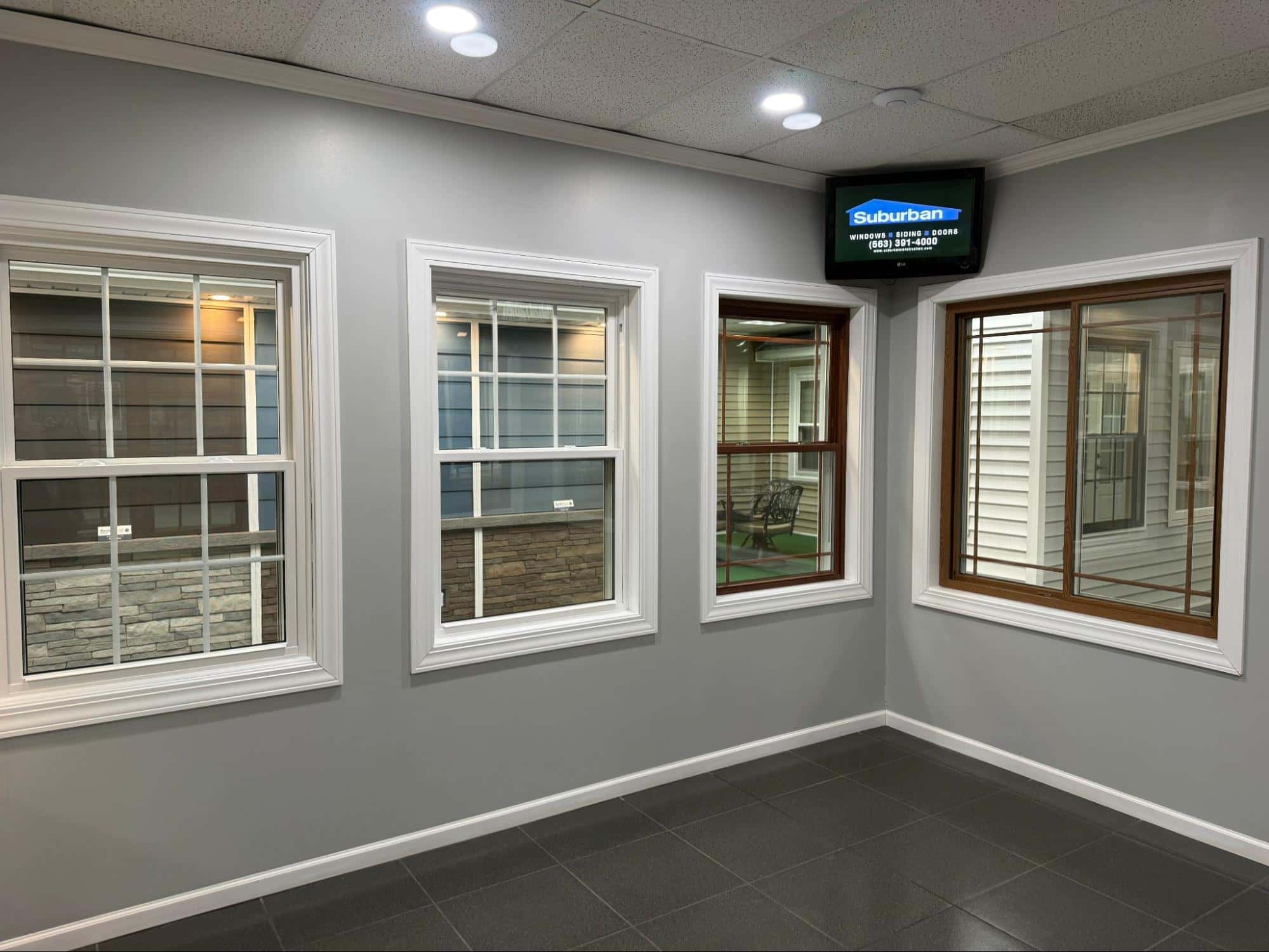Suburban Wholesale & Supply showroom — full-scale home exterior display