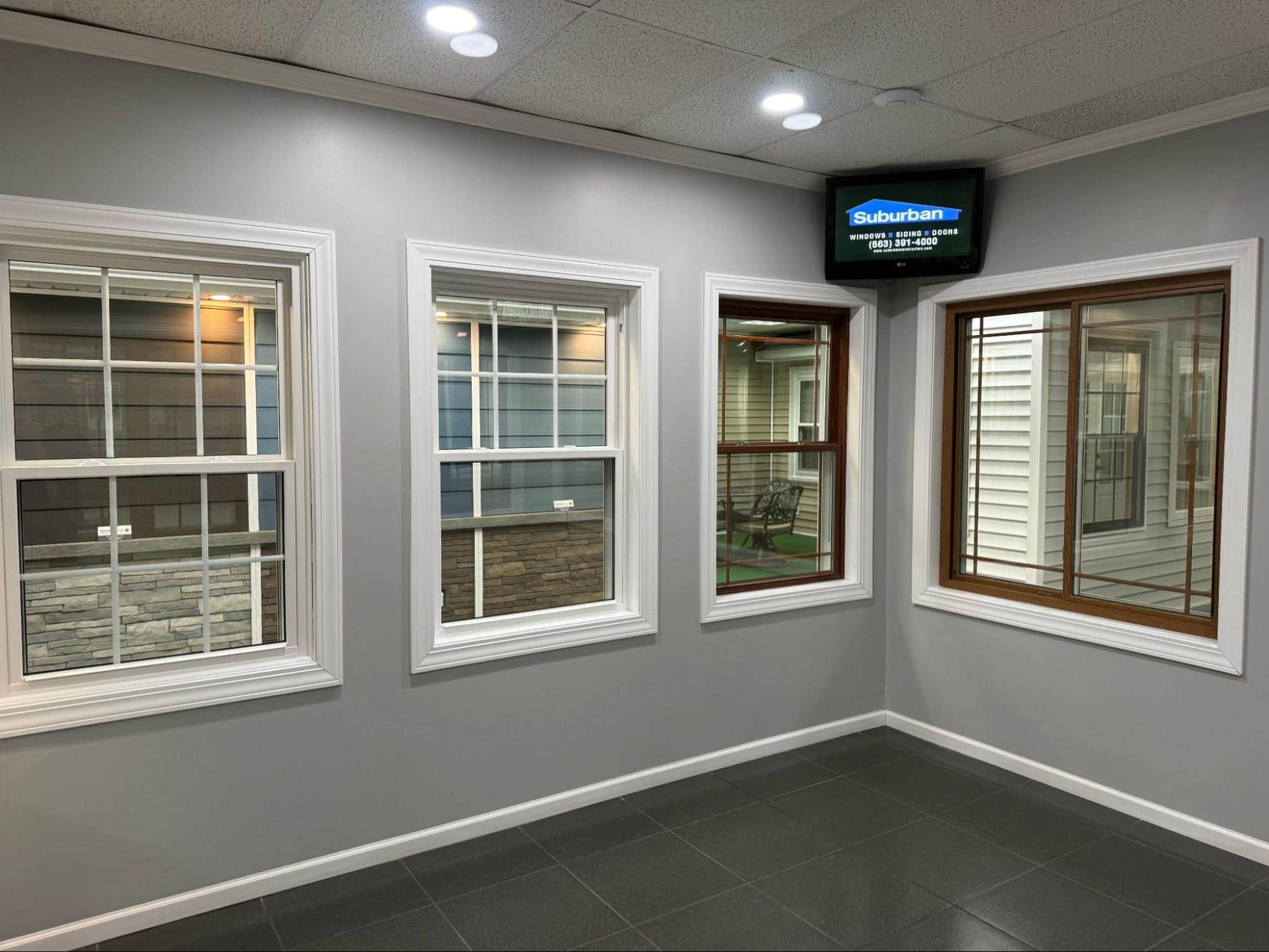 Suburban Wholesale & Supply showroom — full-scale home exterior display
