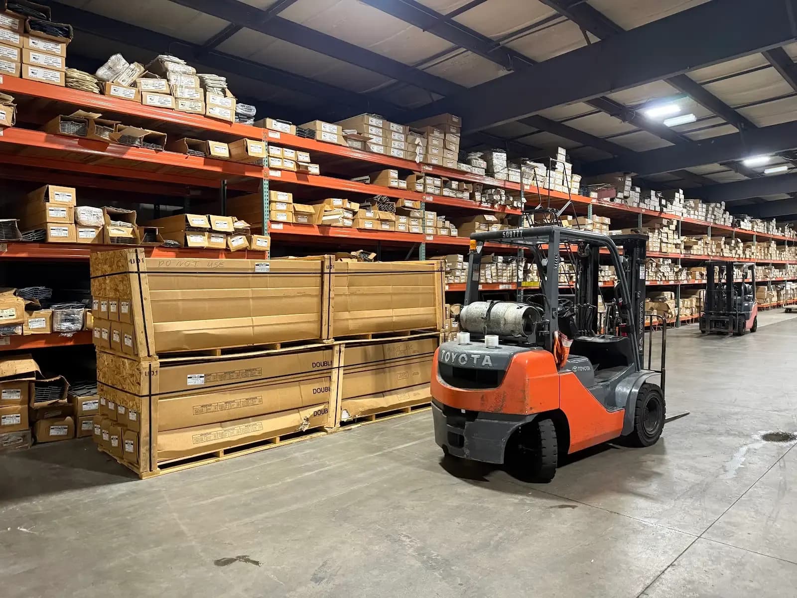 Crated siding and a forklift in the warehouse